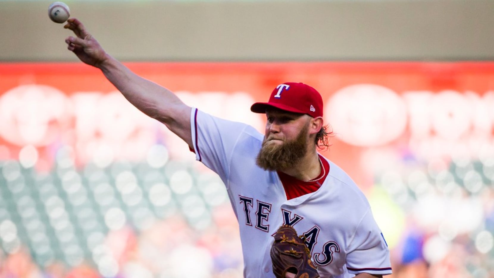 Texas Rangers starting pitcher Andrew Cashner delivers a pitch during the first inning...