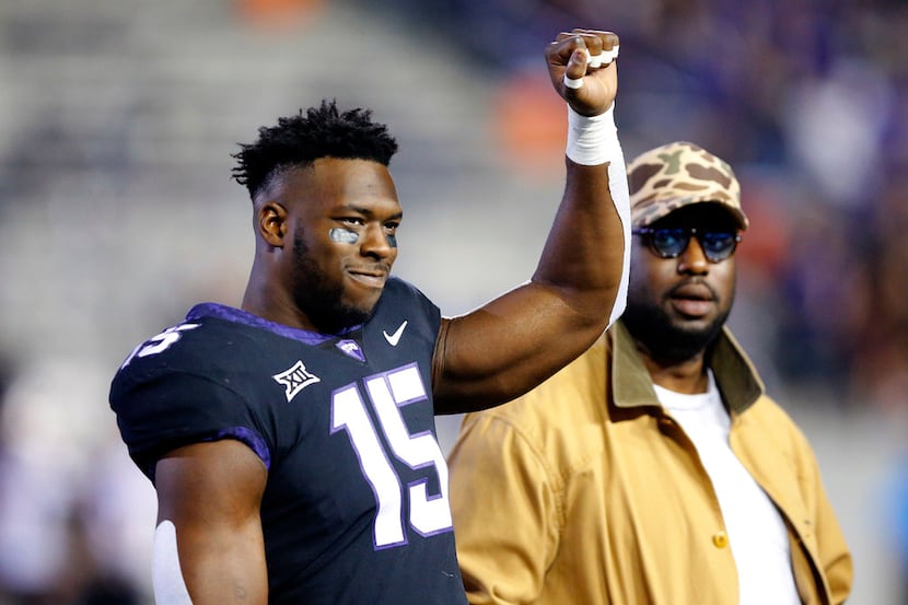 TCU Horned Frogs defensive end Ben Banogu (15) waves as he's introduced during Senior Night...