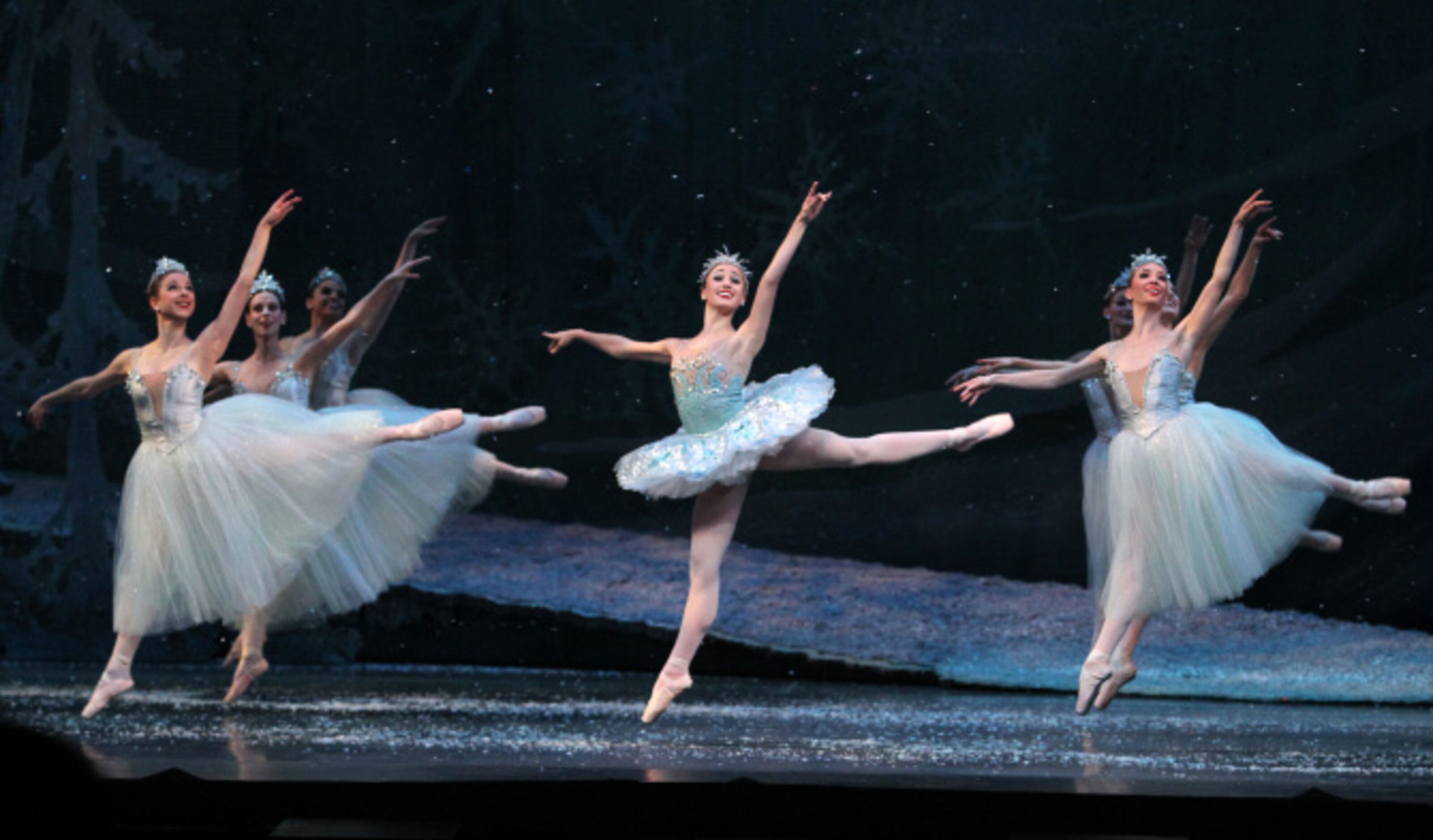 The Snow Queen played by Betsy McBride dances with Snowflakes in Texas Ballet Theater's "The...