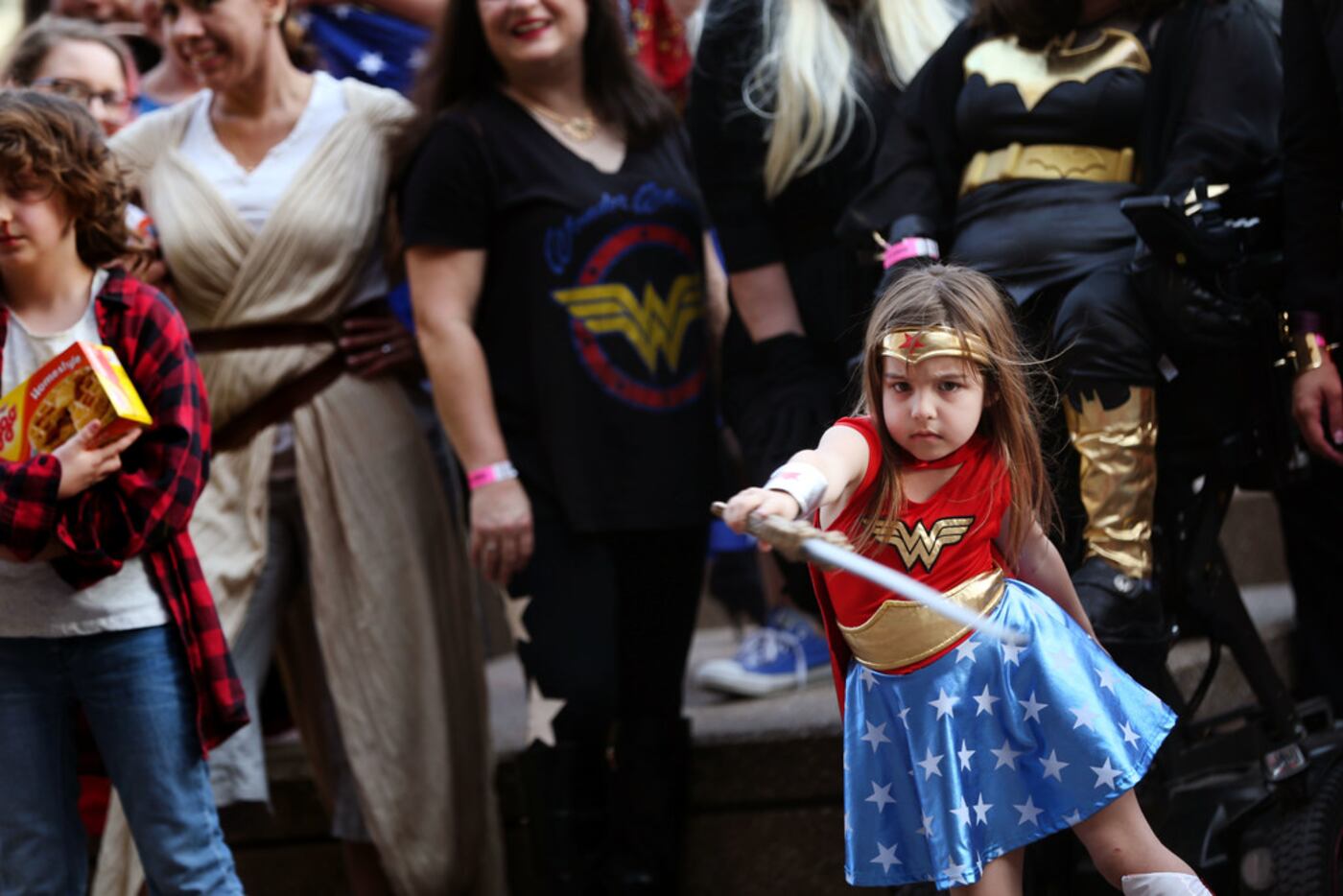 Raquel Compton, 5, poses for a photograph with other female superheroes during Women of...