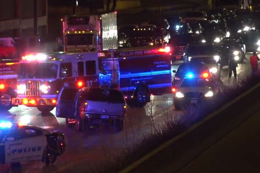 Rescue vehicles line the southbound lanes of North Central Expressway Thursday morning,...
