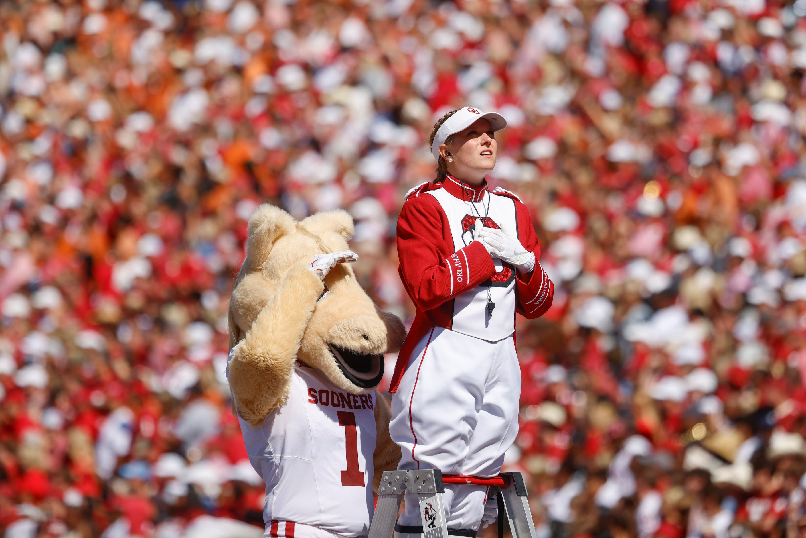 Oklahoma band members wait eagerly for a touchdown during the first half of the Red River...