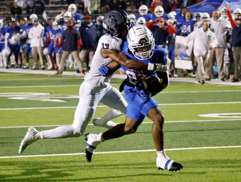 Allen running back Micah Ellis (27) carried Arlington Martin defensive back Zavien...