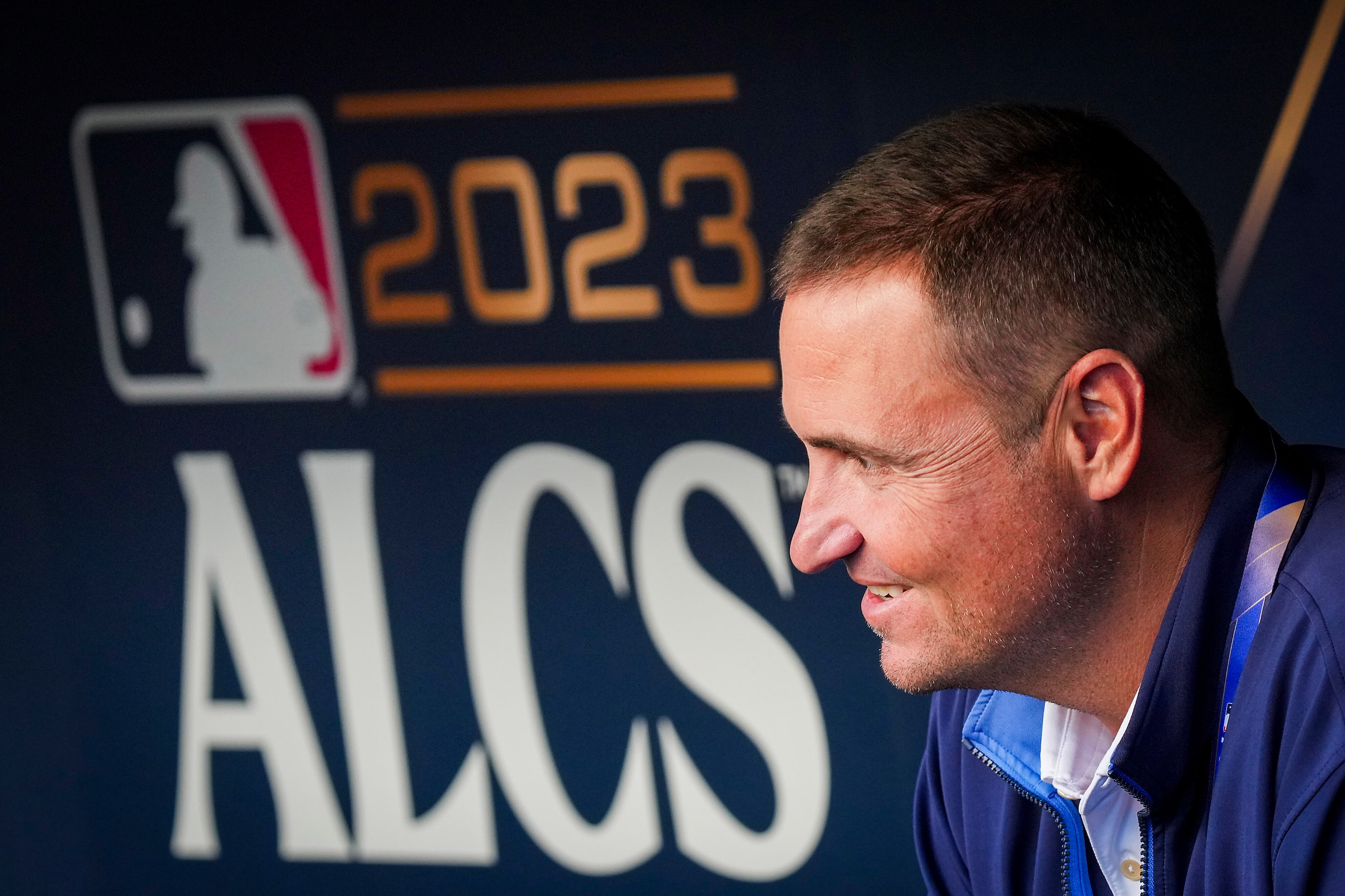 Texas Rangers general manager Chris Young watches from the dugout during a workout in...