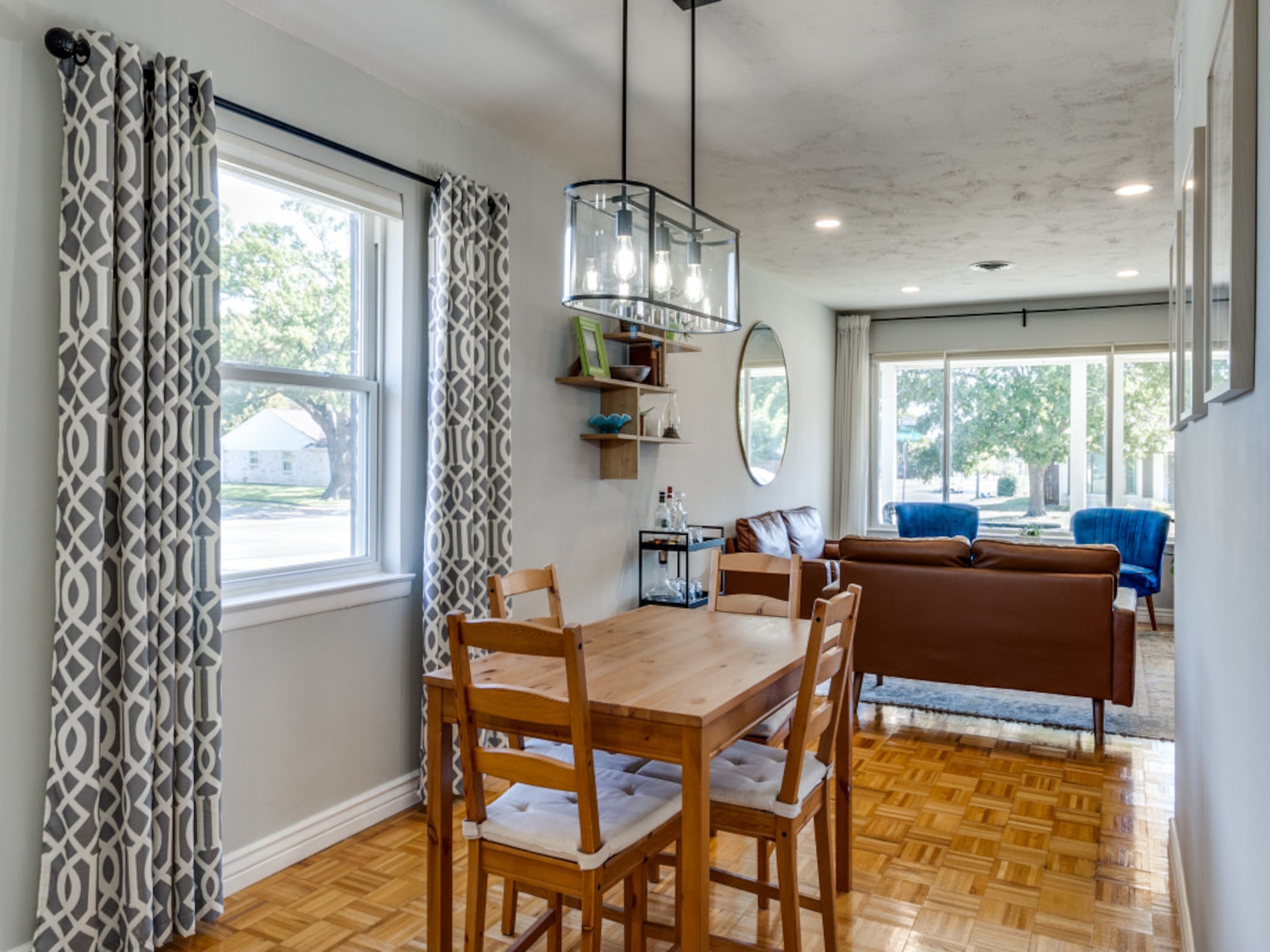 A dining area sits between the kitchen and the living room.