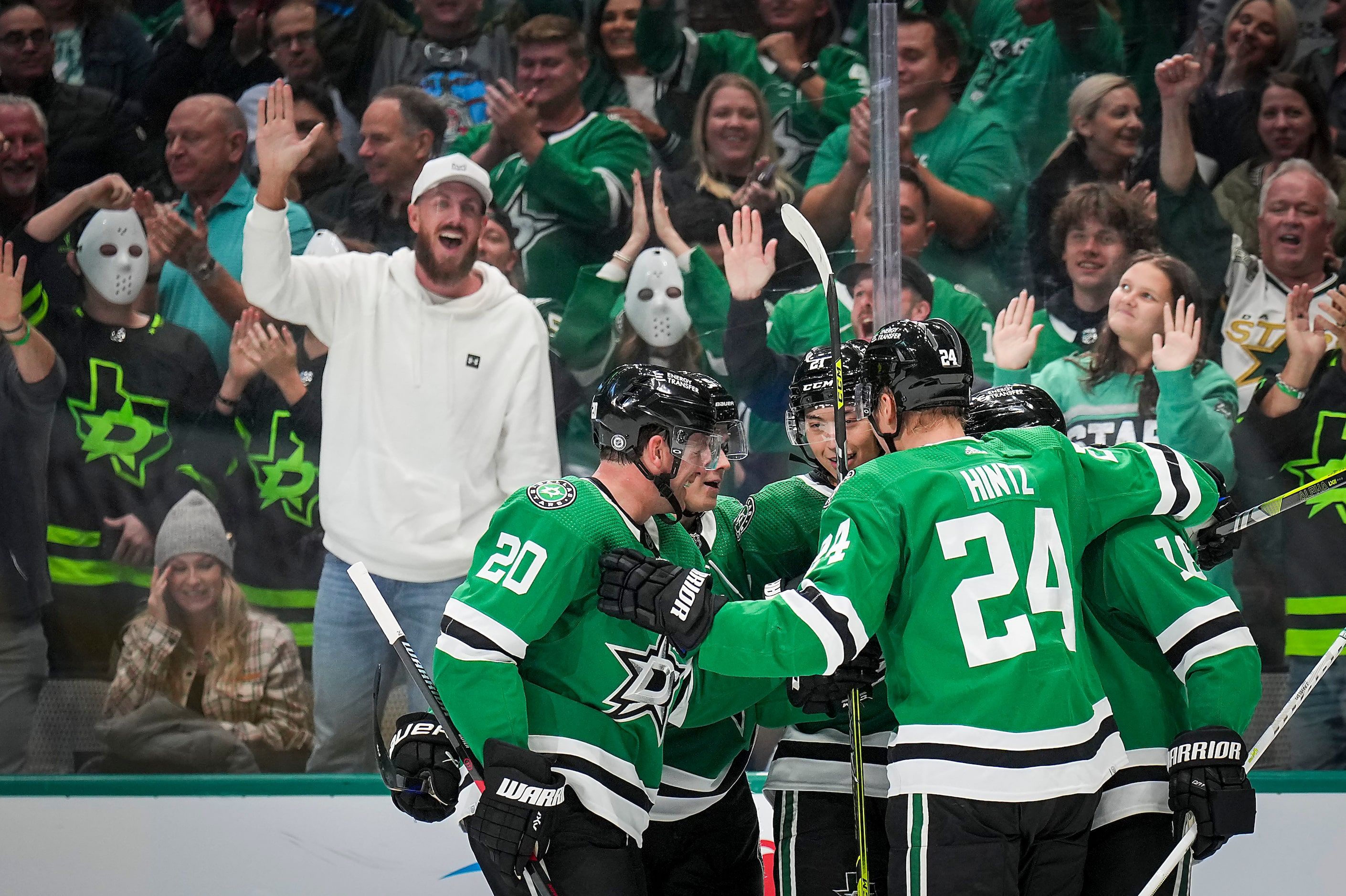 Dallas Stars defenseman Ryan Suter (20) and center Roope Hintz (24) join the celebration...