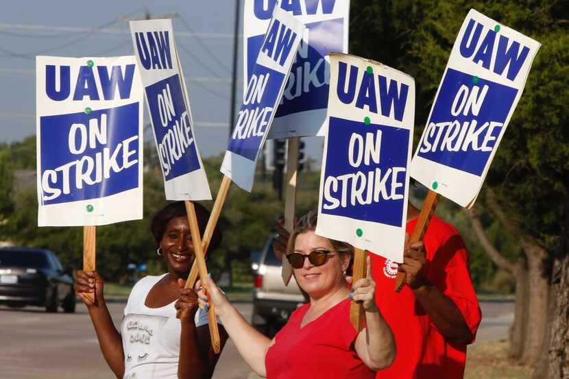 General Motors workers walk the picket line early Monday, September 16, 2019, at the GM...