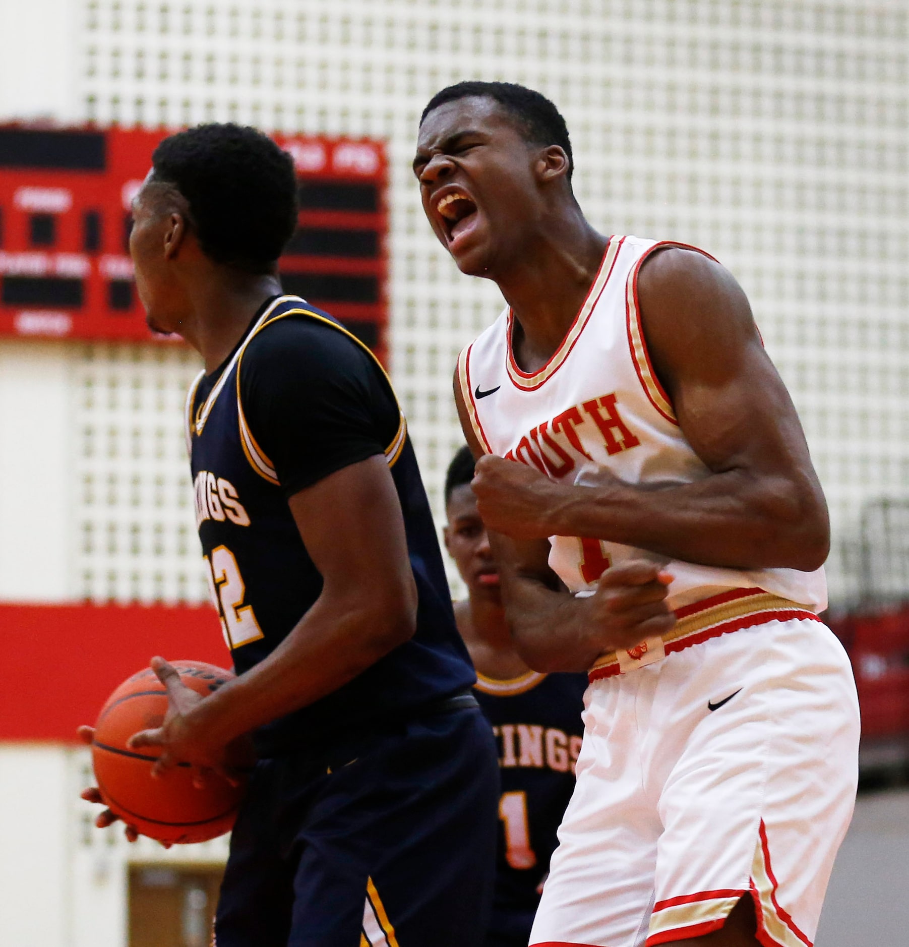 South Grand Prairie's Jaden Flournoy (1) celebrates next to  Arlington Lamar's Cameron Brady...