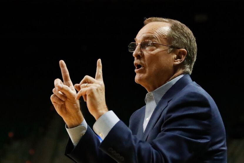 Oklahoma head basketball coach Lon Kruger calls in an offensive play against Baylor in the...