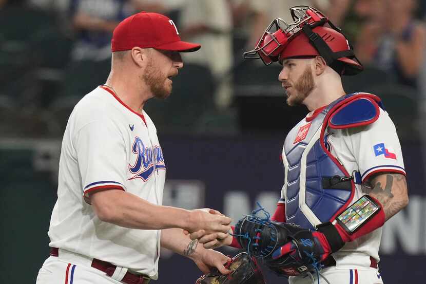 Texas Rangers closing pitcher Will Smith, left, is congratulated by teammate catcher Jonah...