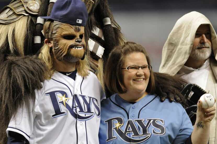 Candace Payne, of Grand Prairie, Texas, the Chewbacca mom, right, celebrates with Chewbacca...