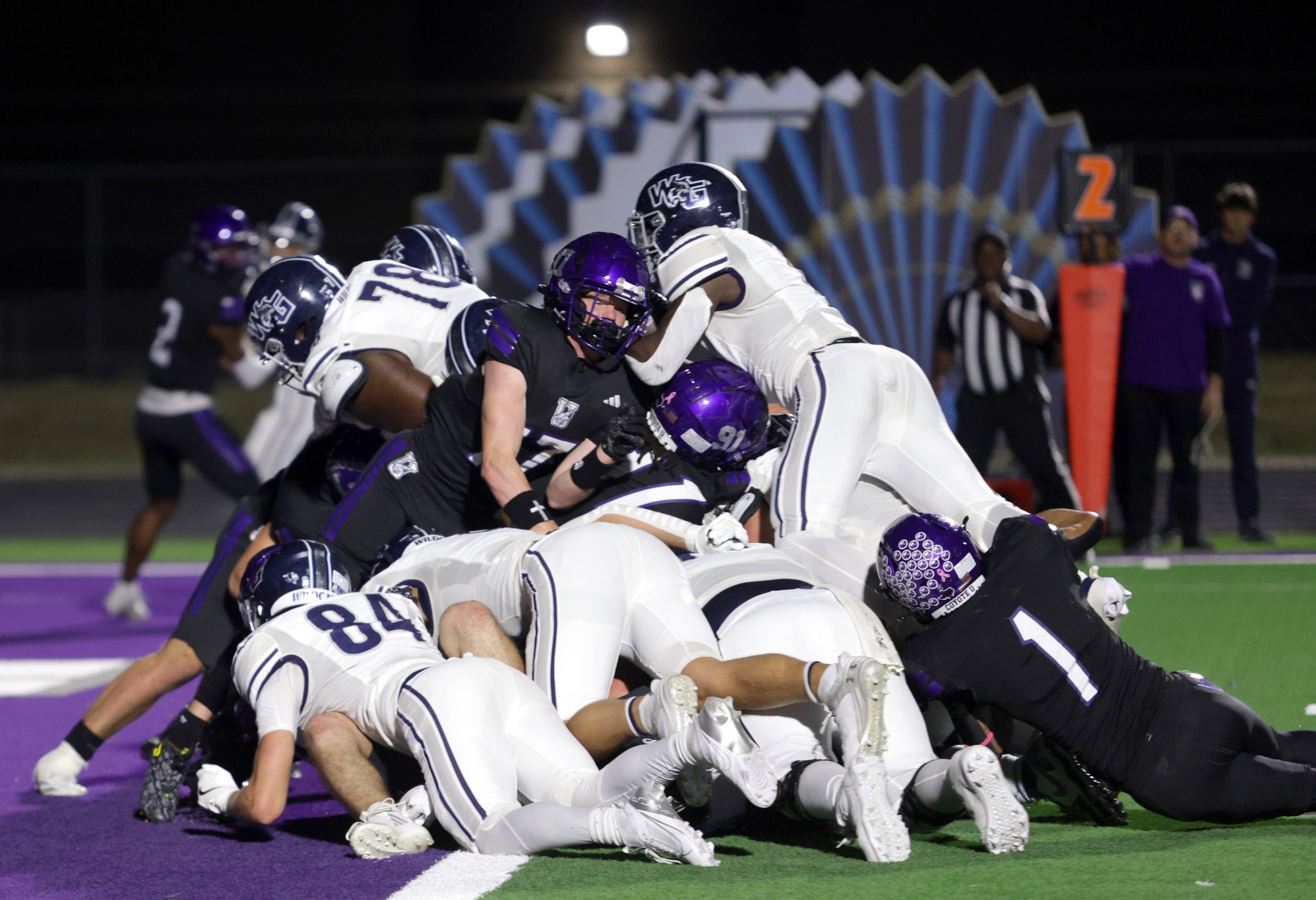 The two teams collide at the goal line during the Prosper Walnut Grove High School versus...