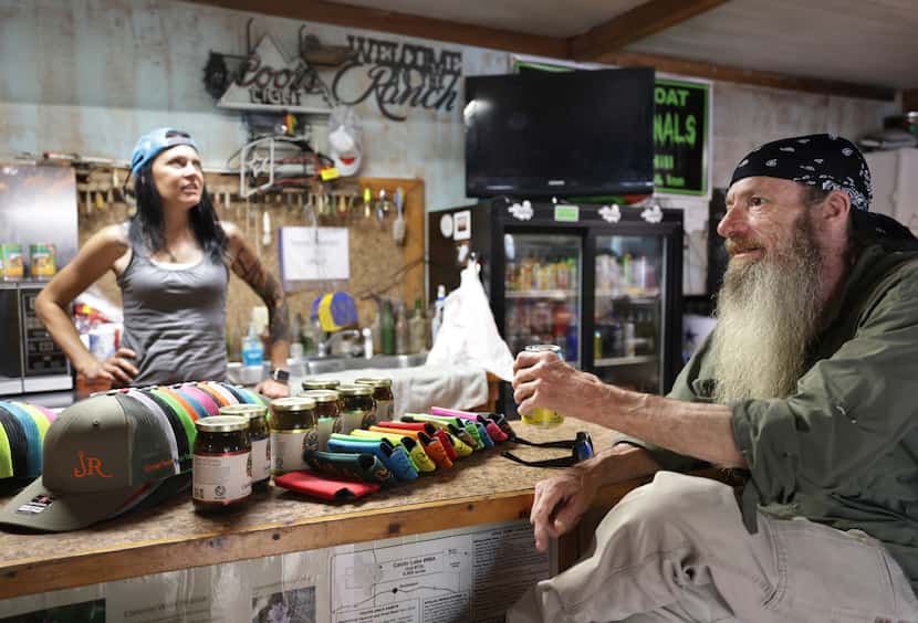 Nikki Carter, left, and Steve Smelley chit-chat at the Johnson's Ranch Marina in Uncertain,...
