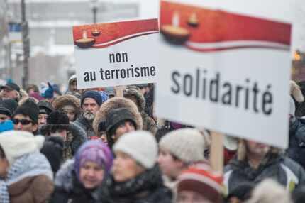 Several hundred people march in solidarity for the victims of the mosque shooting in Quebec...