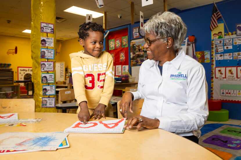 Rodney Hendrix, 4, talks to Murriel Webb, director of Braswell Child Development Center, in...