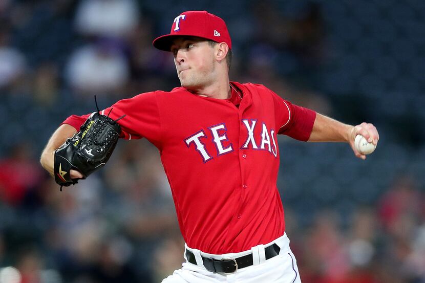 ARLINGTON, TX - AUGUST 14:  Jeffrey Springs #54 of the Texas Rangers pitches against the...