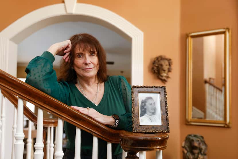 Dr. Terri Howard-Hughes poses with a photo of her mother,  Angela J. Burke, on Sunday, Dec....