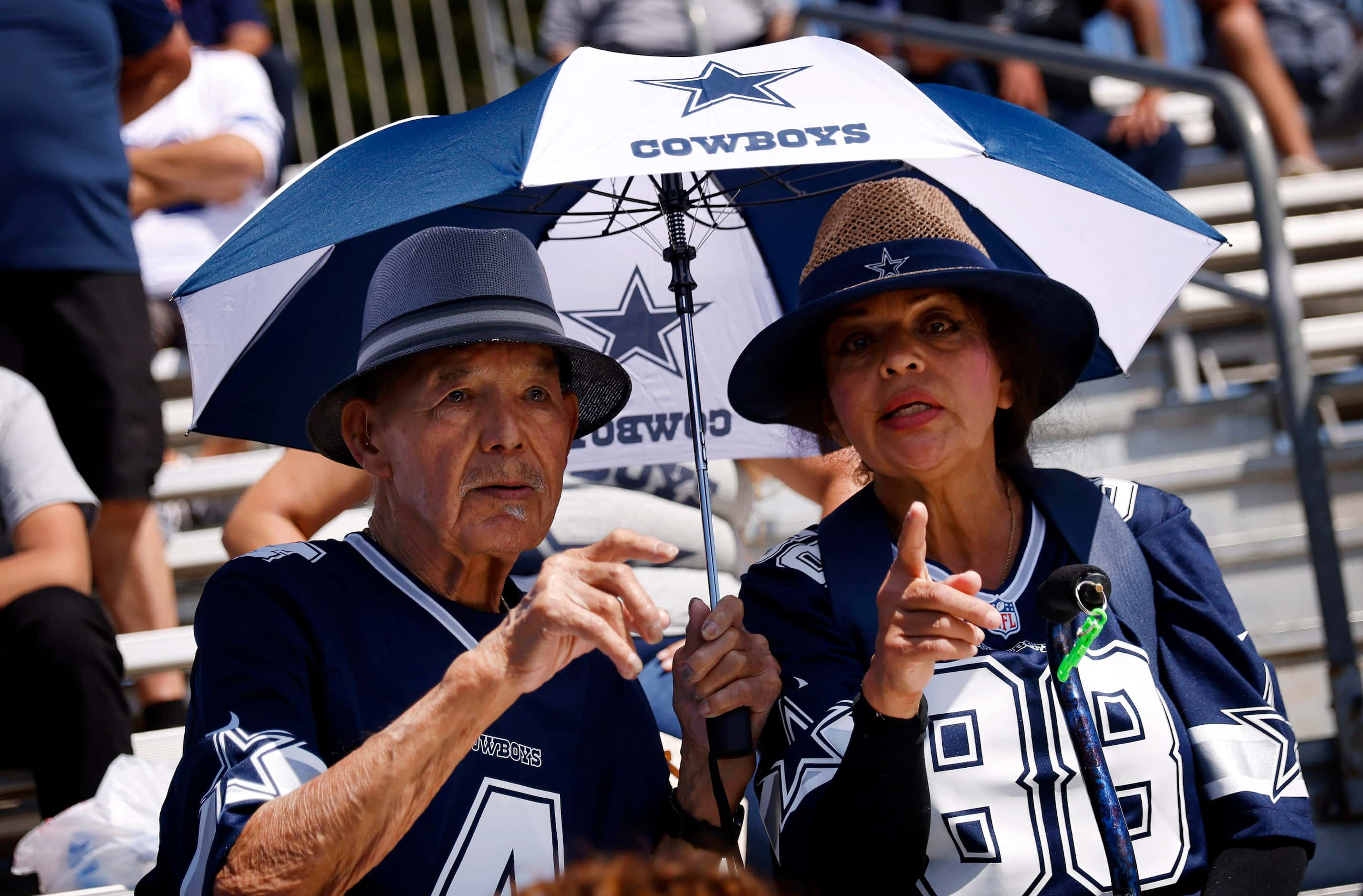 Rose Rangel (right) and her friend Henry Busane of Orange County, California point to...