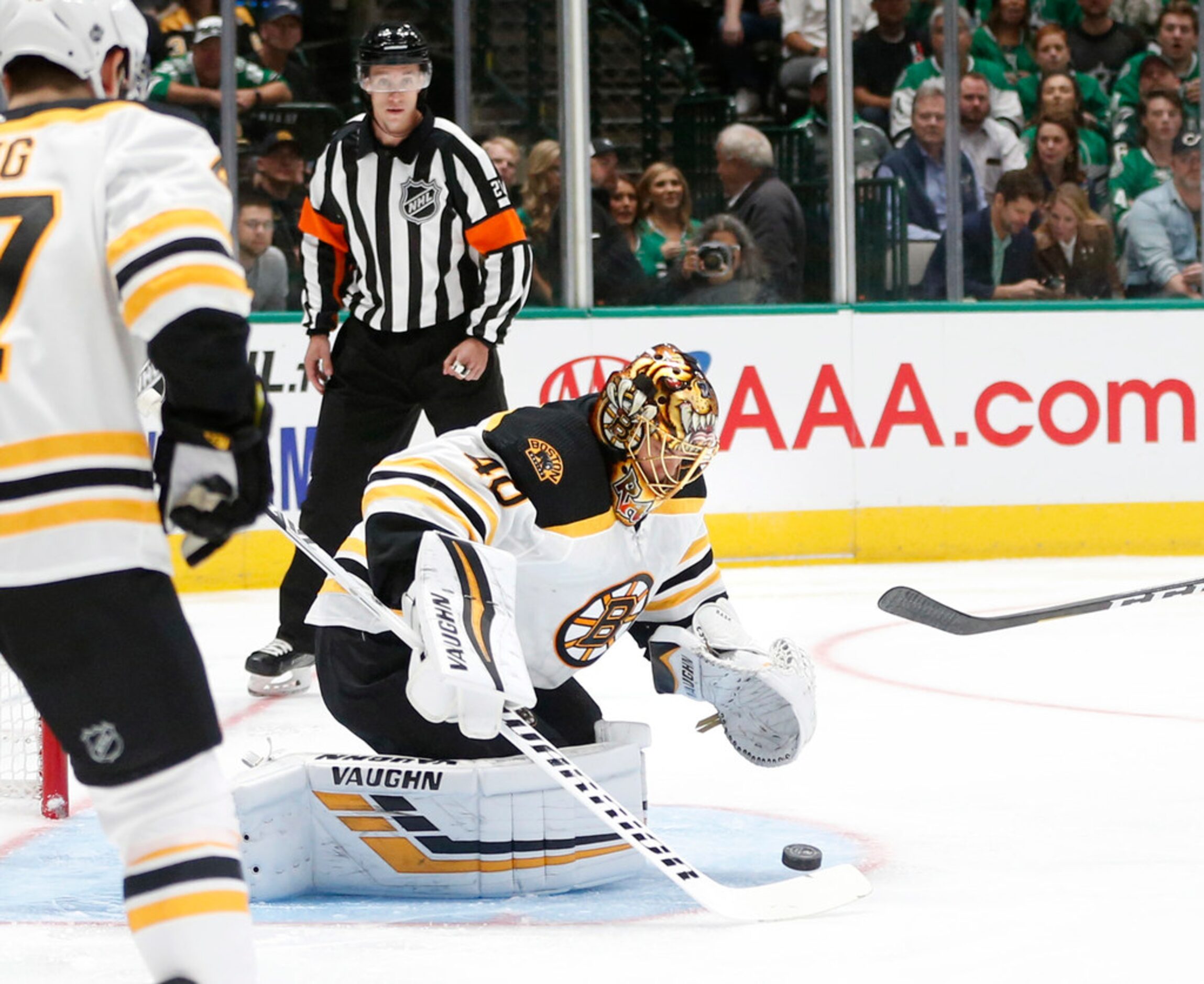 Boston Bruins goaltender Tuukka Rask (40) stops a shot on goal in a game against the Dallas...