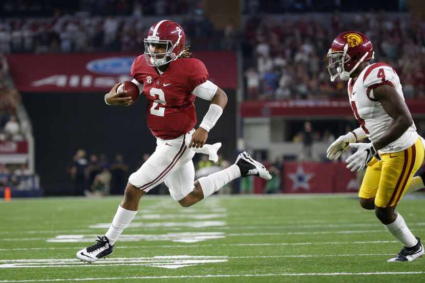 Alabama quarterback Jalen Hurts (2) scores a touchdown past Southern California defensive...