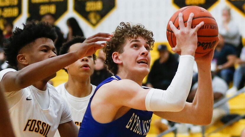 Byron Nelson High School Finley Bizjack (3) holds the ball ready to shoot during the first...