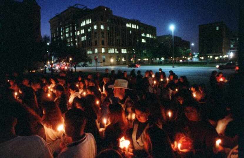 Fans gather at the JFK Memorial in downtown Dallas to honor Selena's memory on March 31, 1995.