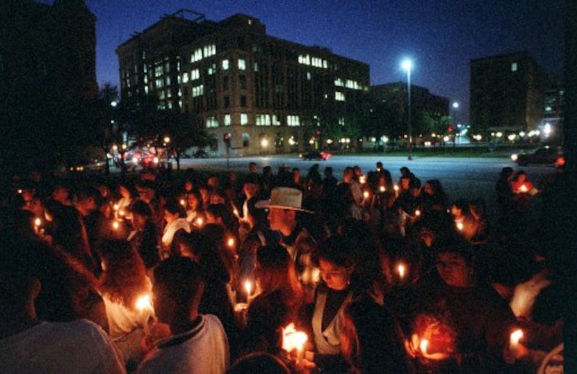 Fans gather at the JFK Memorial in downtown Dallas to honor Selena's memory on March 31, 1995.