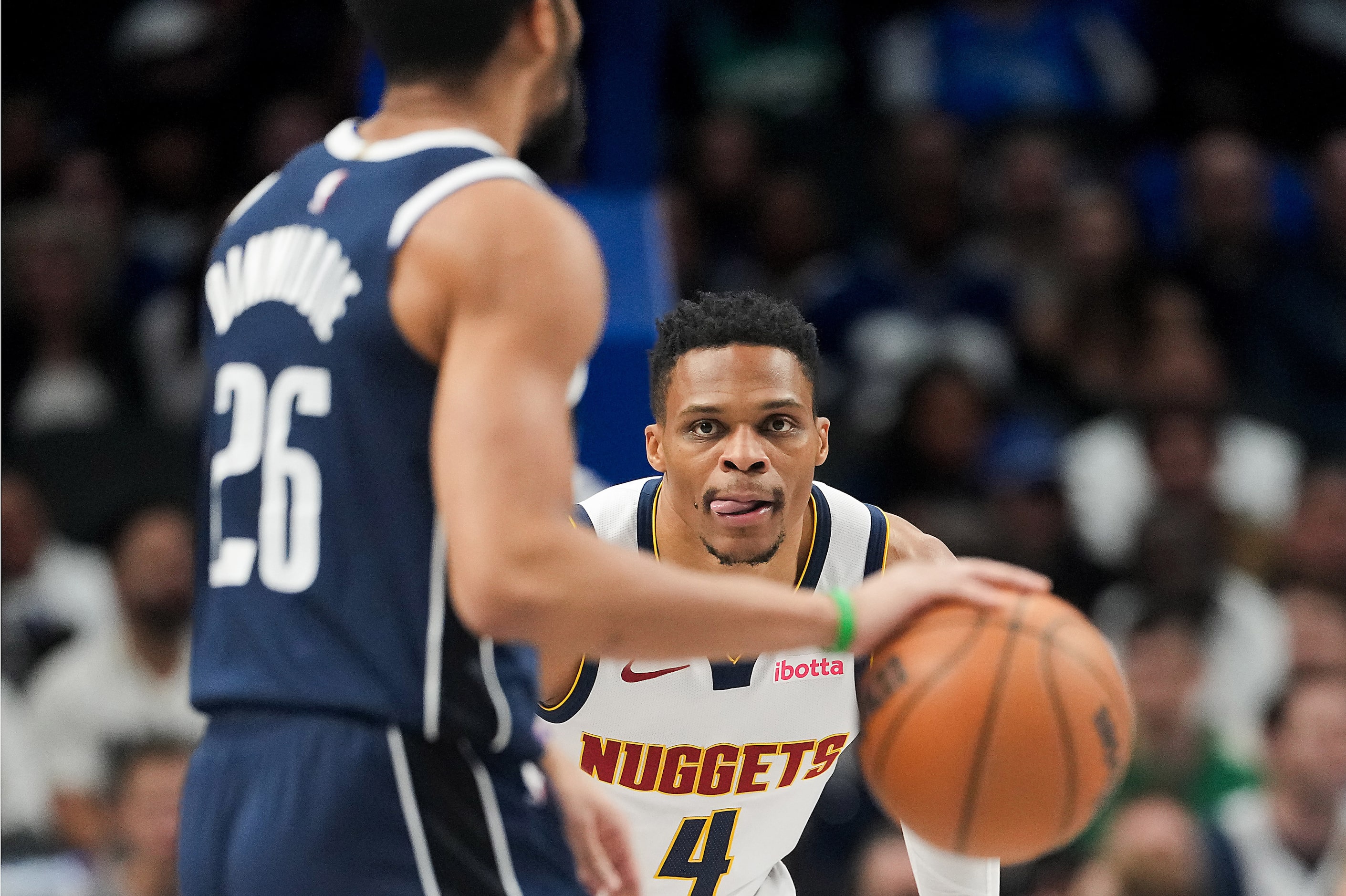 Denver Nuggets guard Russell Westbrook (4) defends against Dallas Mavericks guard Spencer...