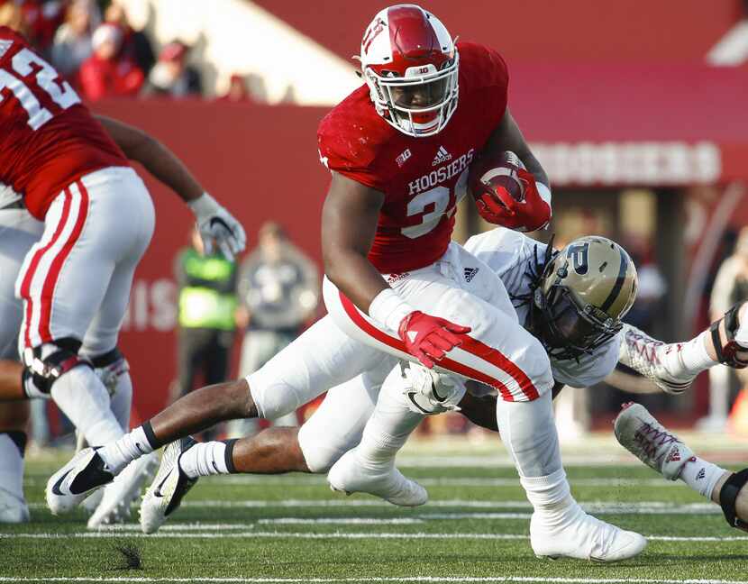BLOOMINGTON, IN - NOVEMBER 26: Tyler Natee #31 of the Indiana Hoosiers runs the ball as...