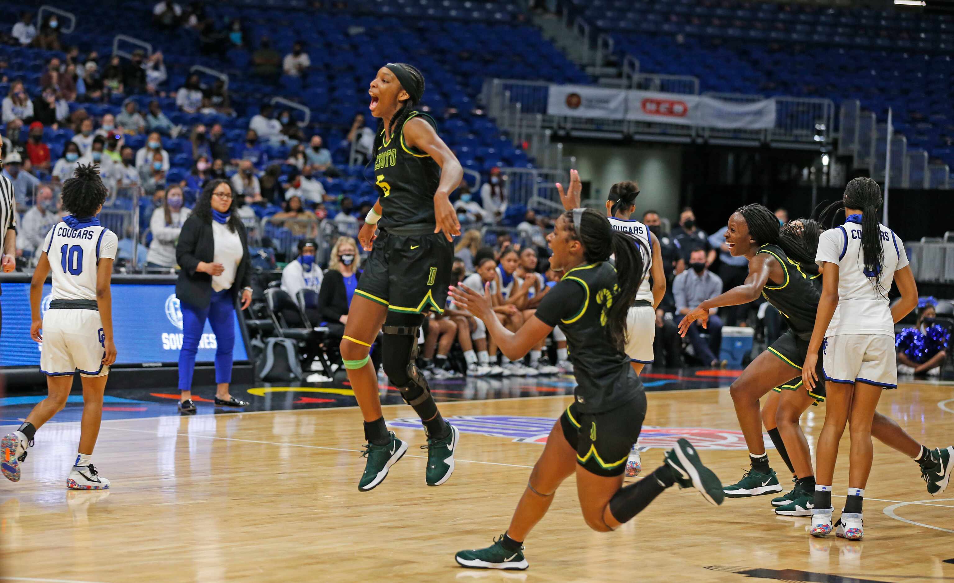 DeSoto Sa’Myah Smith #5 leaps in the air after defeating Cypress Creek. DeSoto vs. Cypress...