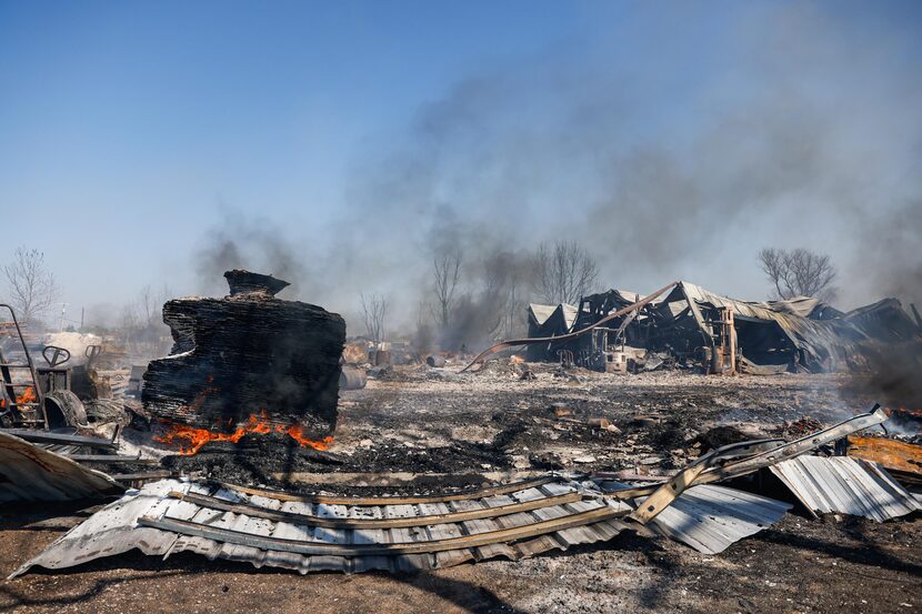 Fire continues to burn in the facilities of a pallet factory in Alvarado on Tuesday, April...