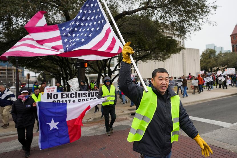 People march in opposition to Texas Senate Bills 147 and 552 on Sunday, Jan. 29, 2023, in...