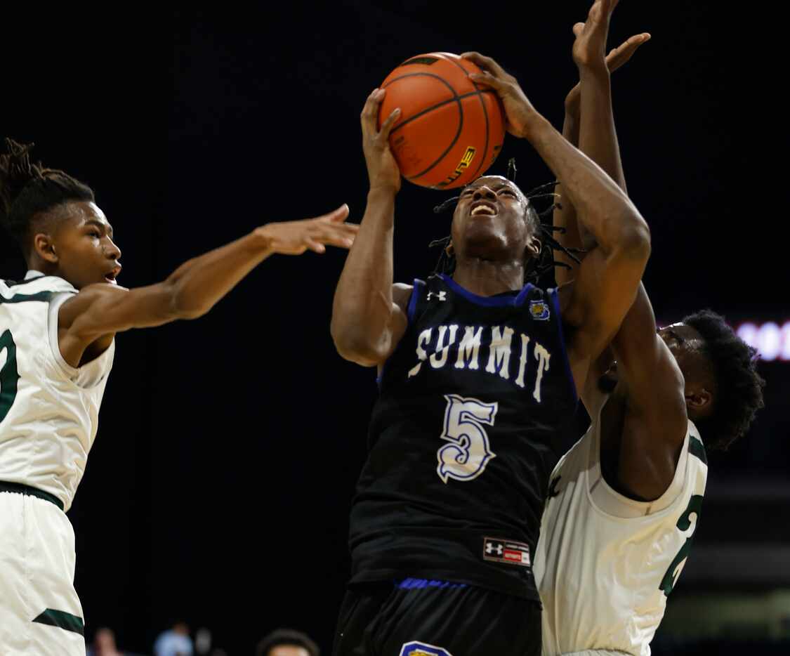 Mansfield Summit David Terrell (5) shots between two Killeen Ellison defenders. Class 5A...