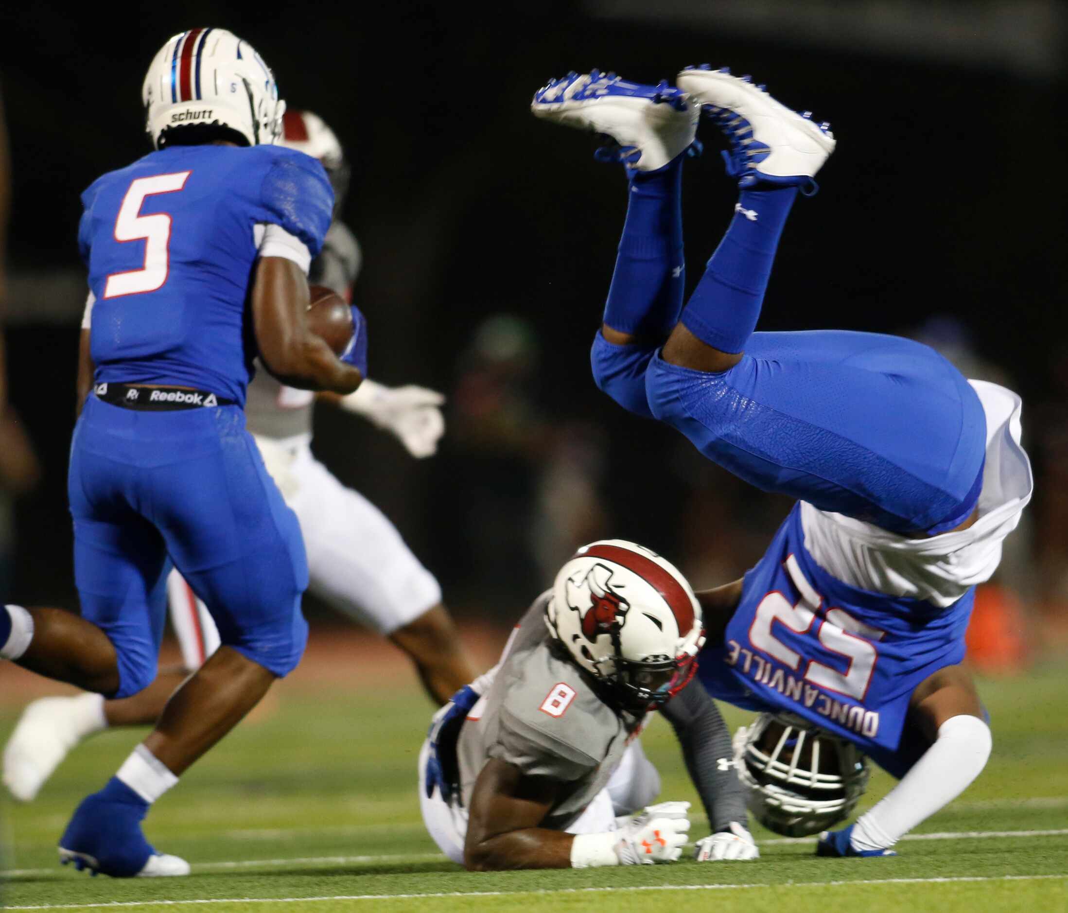 Duncanville running back Malachi Medlock (5) looks for running room as  Panthers offensive...