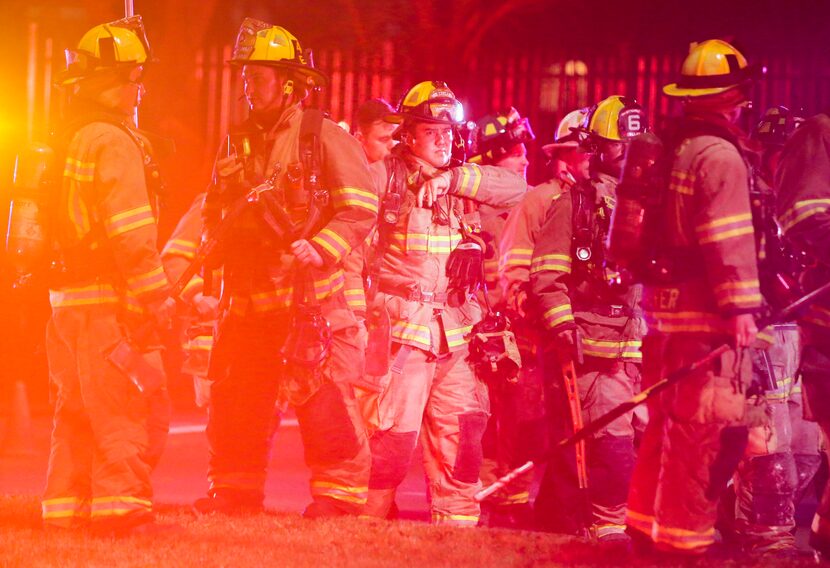 Emergency personnel work at the scene of an underground electrical vault fire in the 300...