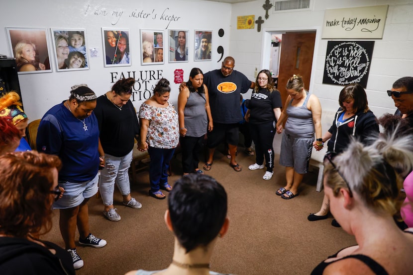 Sydney Navarro (third from left) prays alongside other Good Girls Agency members on, Sunday,...