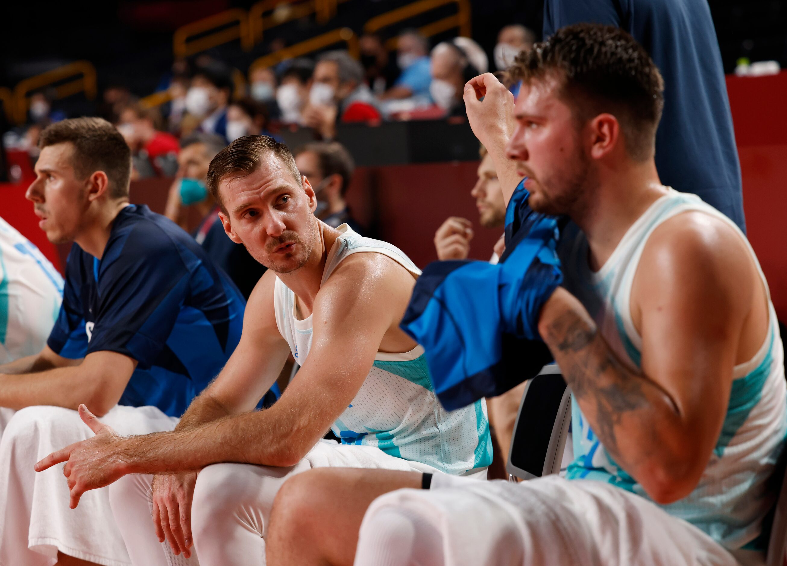 Slovenia’s Zoran Dragic (30) and Luka Doncic talk on the bench in a basketball game against...