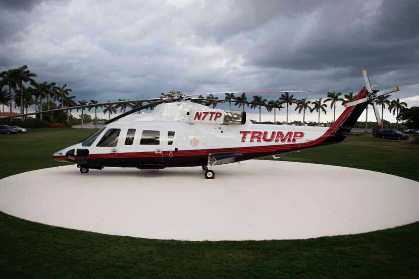 President Donald Trump's helicopter rest on a helipad at the Mar-a-Lago estate in Palm...