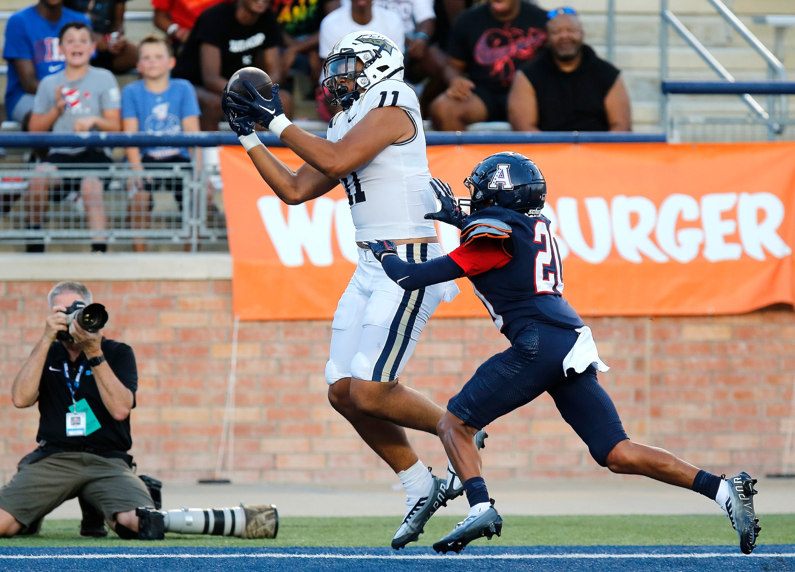 St. John Bosco High School tight end Matayo Uiagalelei (11) catches a touchdown as Allen...