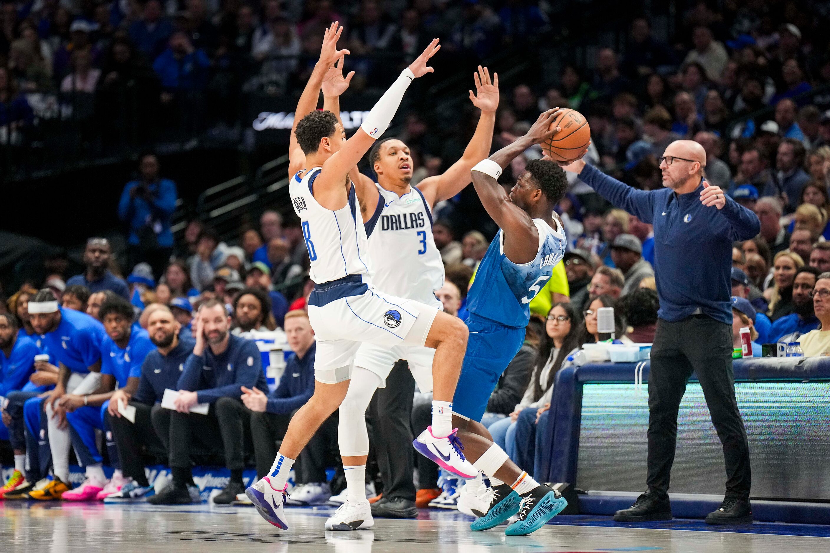 Dallas Mavericks guard Josh Green (8) and forward Grant Williams (3) double-team Minnesota...