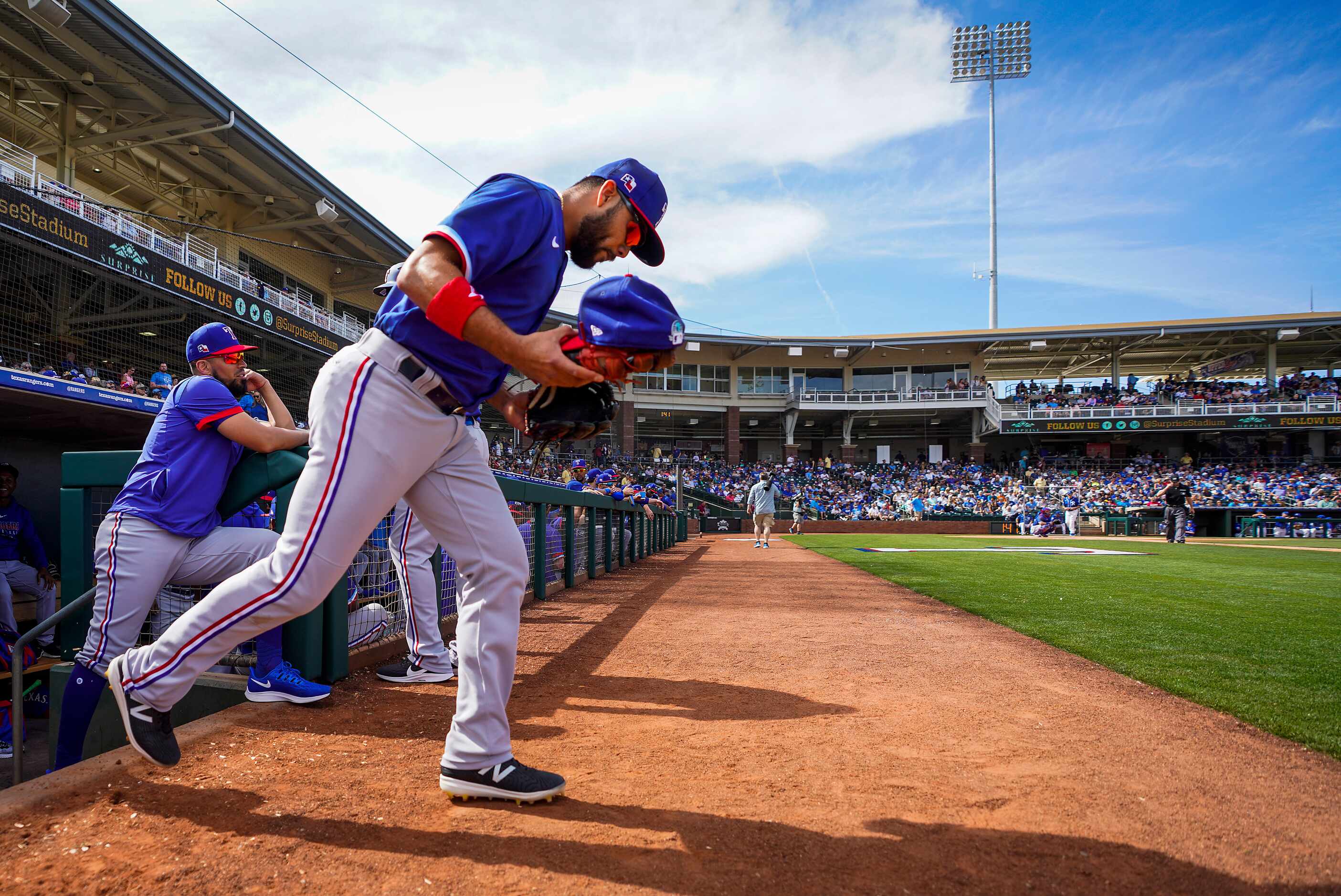 Texas Rangers infielder Isiah Kiner-Falefa takes the field for a spring training game...