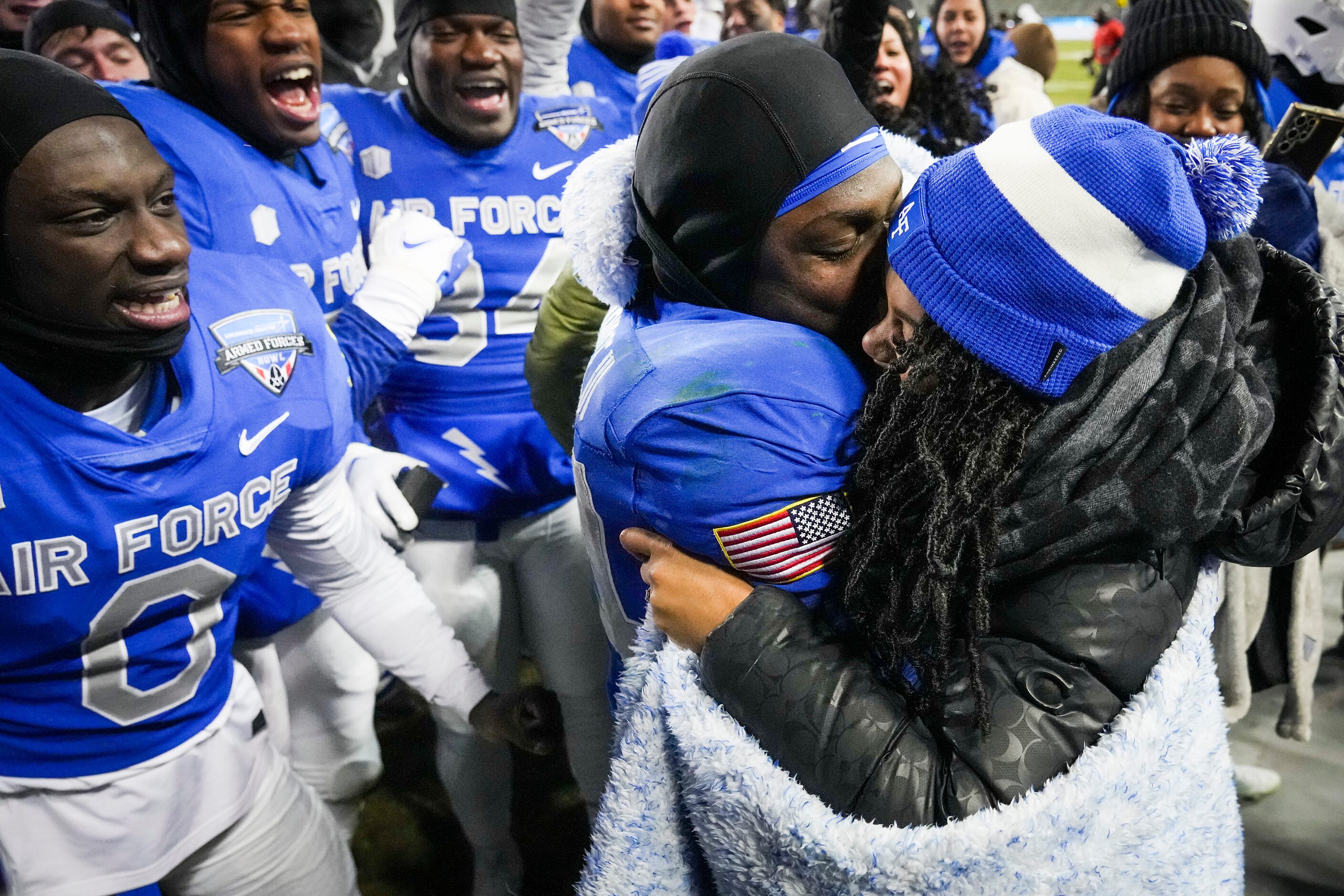 Air Force defensive back Cameron Breier (24) hugs Shanice Atkins after she accepted his...