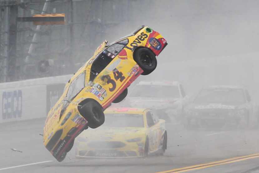 Chris Buescher (34) wrecks during the NASCAR Talladega auto race at Talladega Superspeedway,...