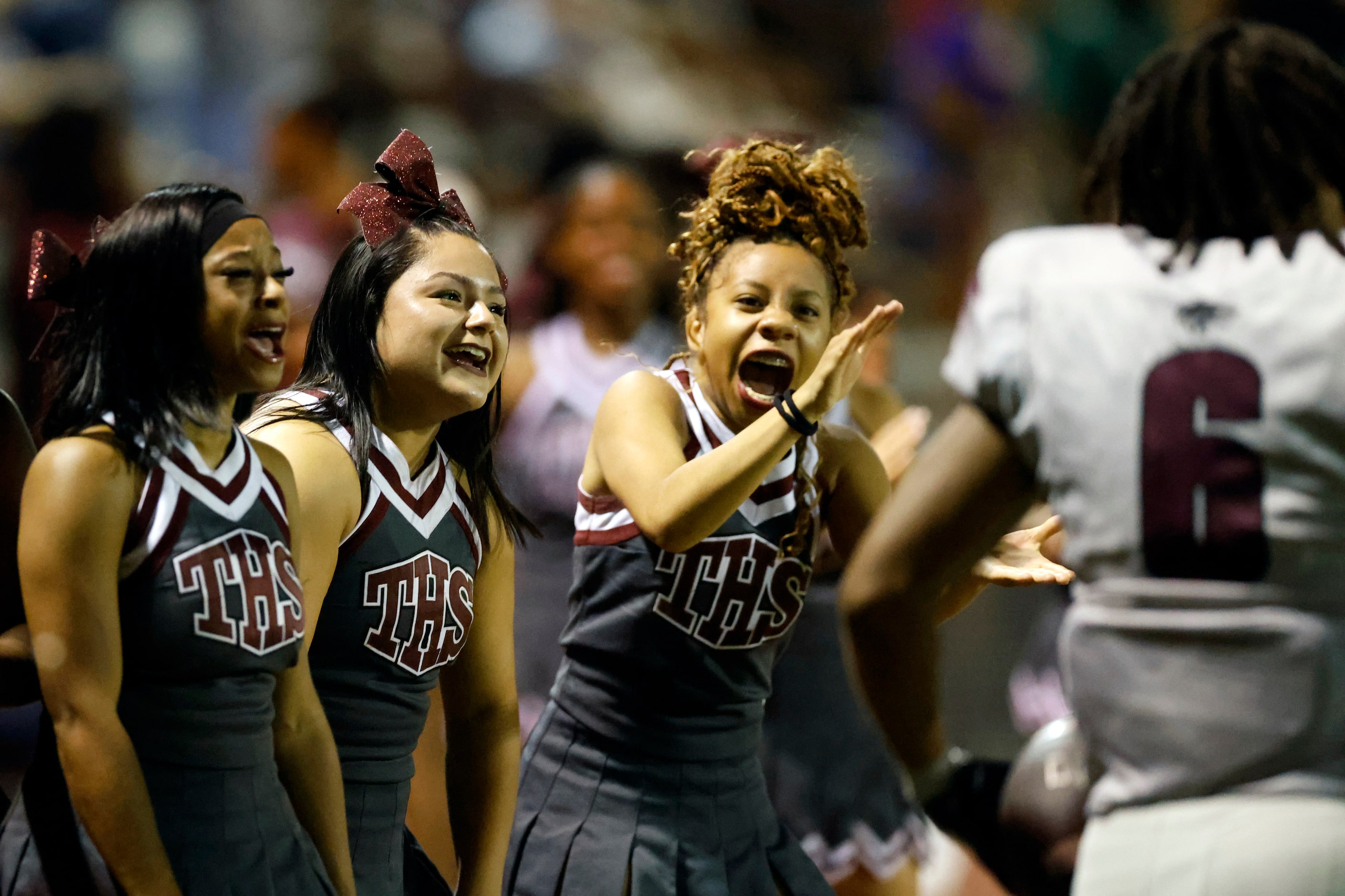 Mansfield Timberview cheerleaders react after running back Jaylon Woods (6) scored a...