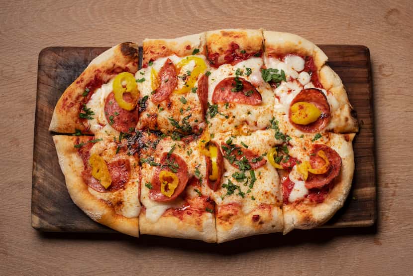 Pizza La Picante is made with salami Calabrese, banana peppers, Calabrese chilis and...