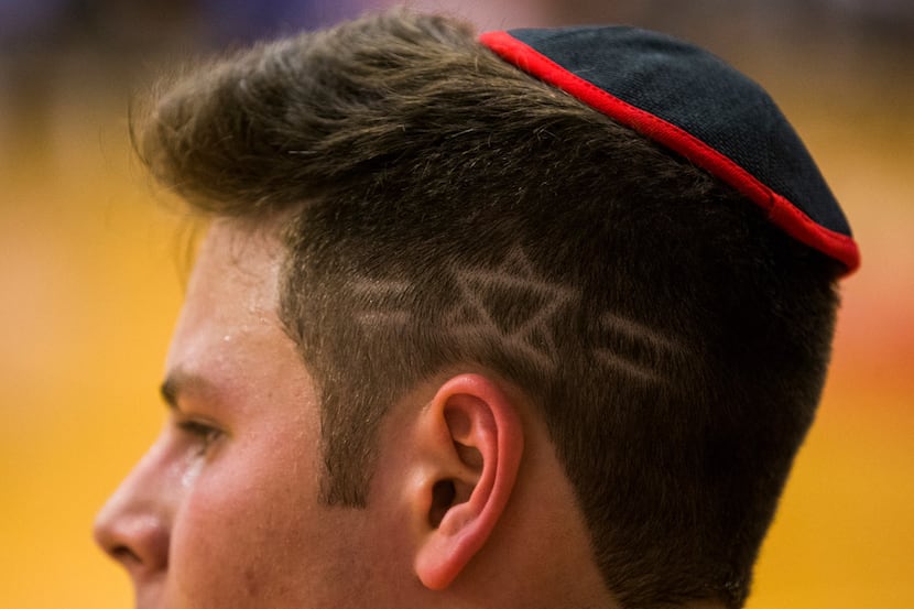 Yavneh's Jonah Eber (4) has a star of David etched in to his hair during a high school boys...