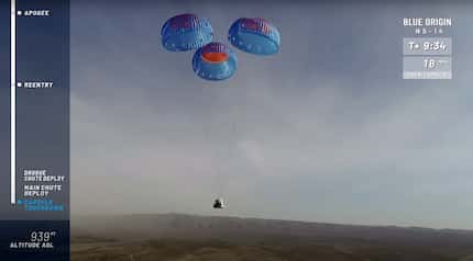 A trio of parachutes deployed to cushion the landing for New Shepard's crew capsule.