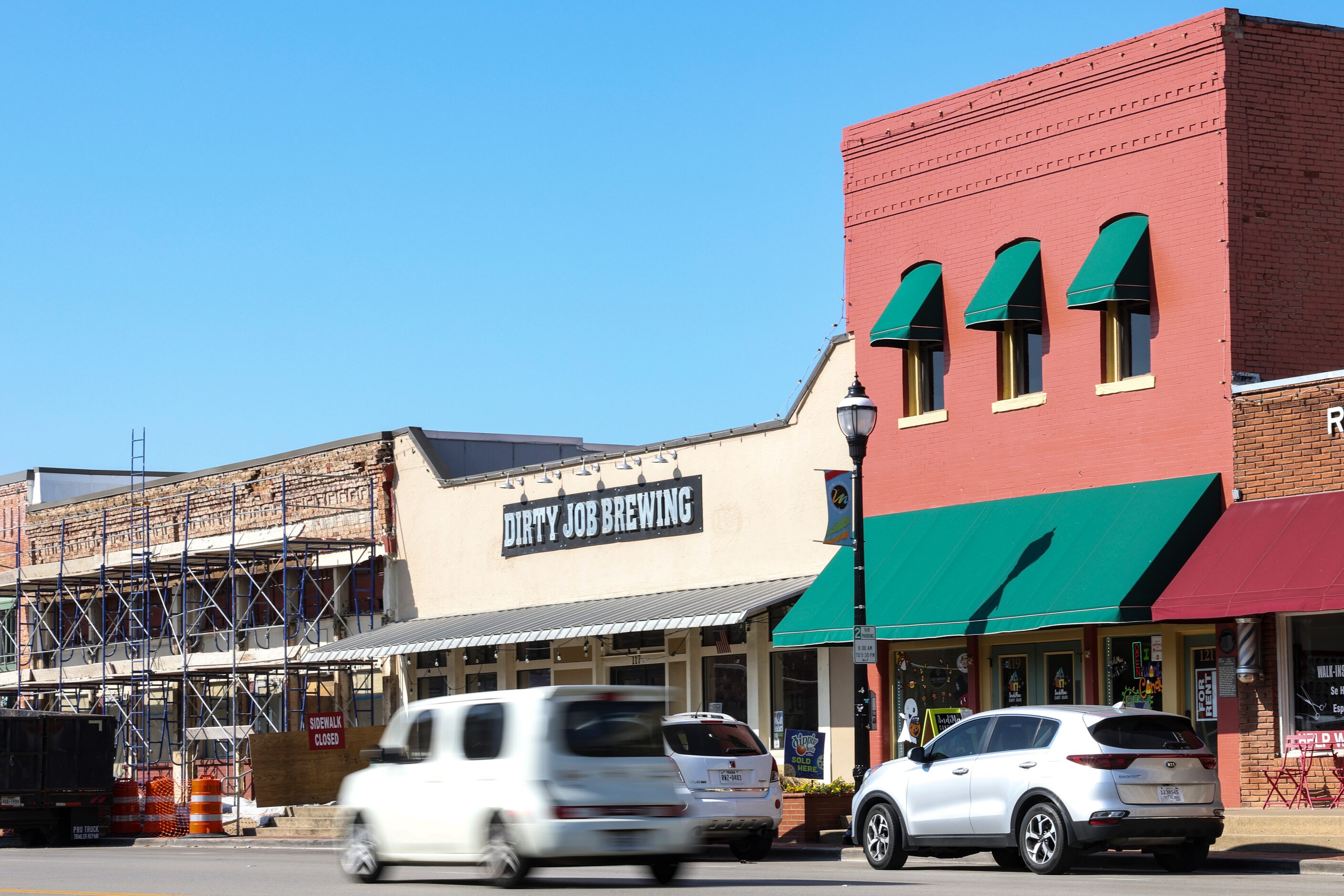 Cars drive down Main Street on Sept. 16 in Mansfield.