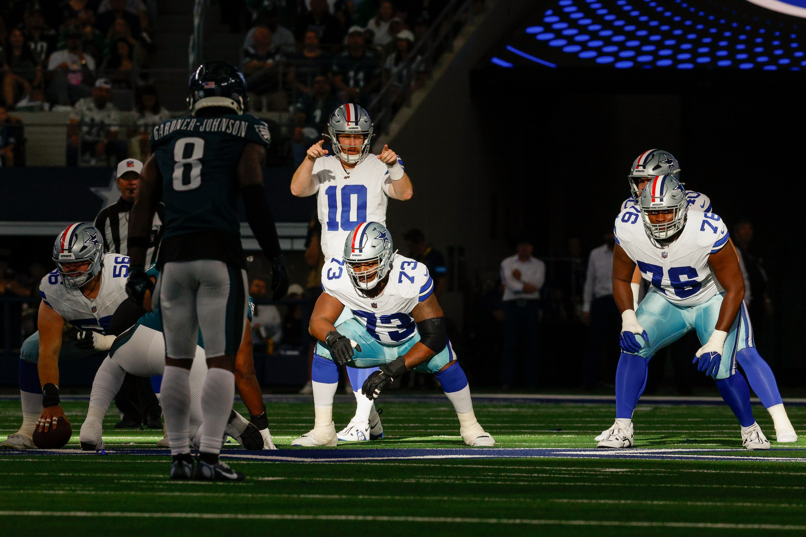 Dallas Cowboys quarterback Cooper Rush (10) motions before the snap during the first half...