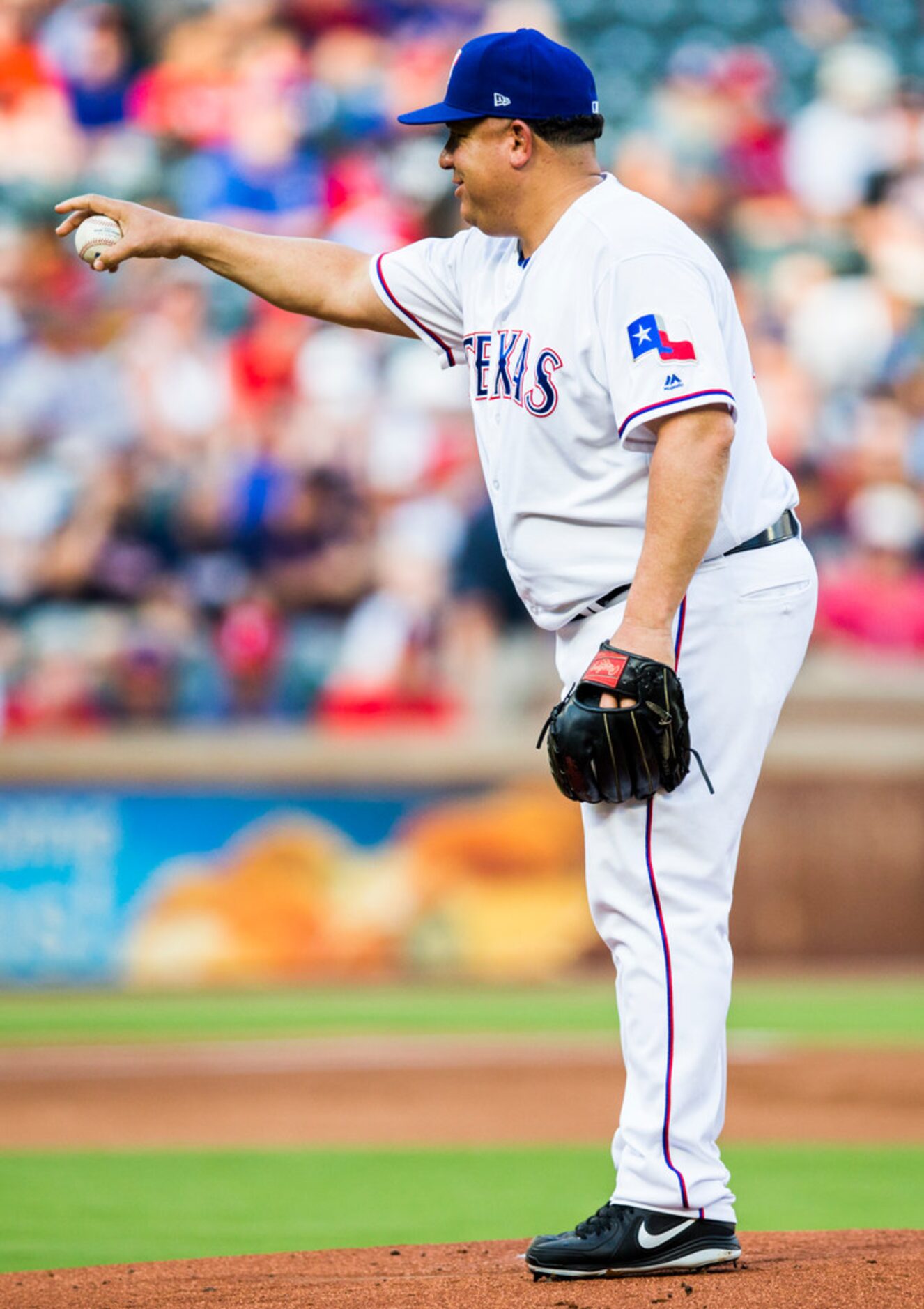 Texas Rangers starting pitcher Bartolo Colon (40) points at home plate during the first...